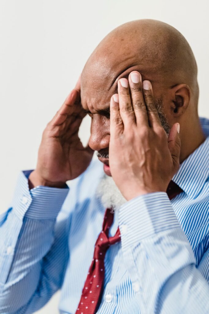 man with a headache after a traumatic brain injury.