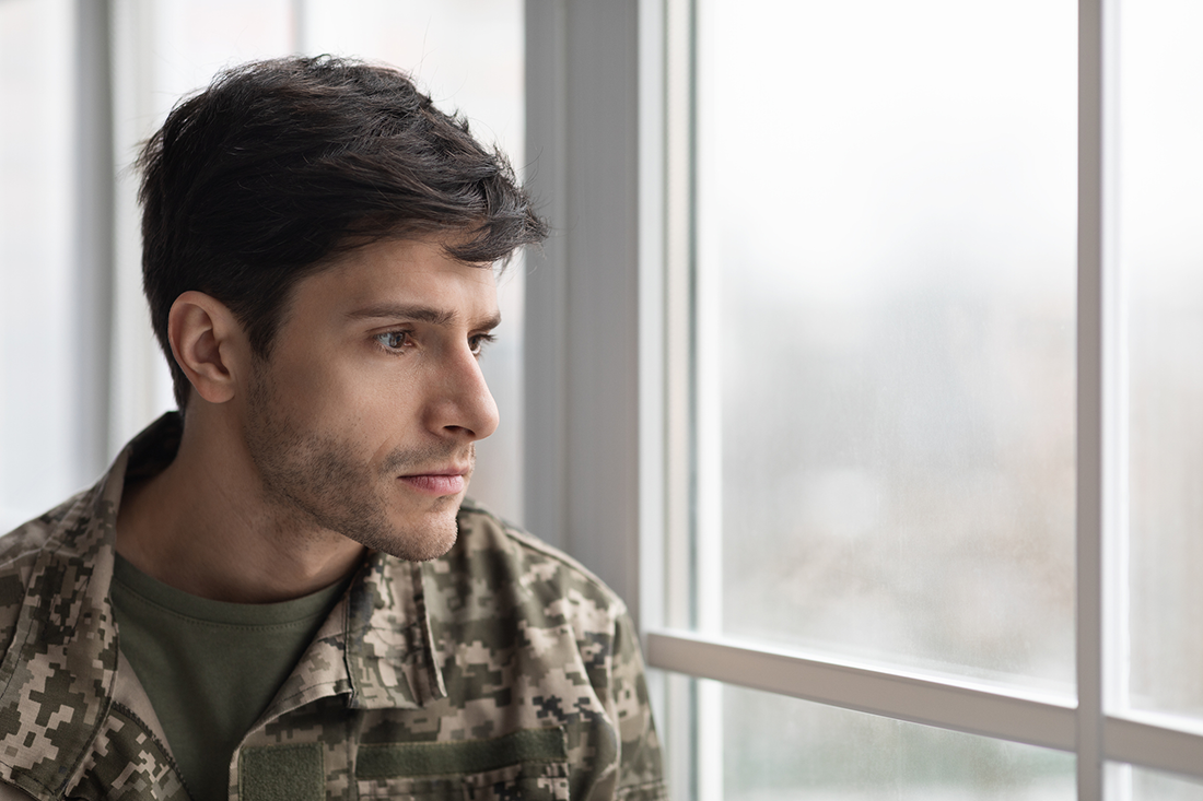 Veteran with PTSD looking out the window